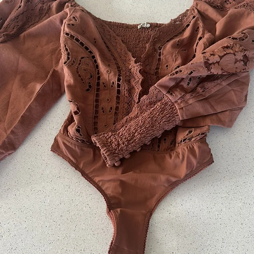 NWOT Free People Regina Bodysuit Top Thong Eyelet Balloon Sleeves Smocked Retro